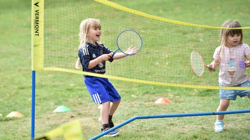 Two children play badminton at Belton's Summer of Play.